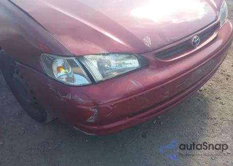 2000 Toyota Corolla Ce z USA, uszkodzony, nr VIN 2T1BR12E4YC314748